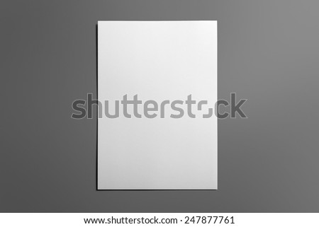Blank flyer poster isolated on grey to replace your design Royalty-Free Stock Photo #247877761