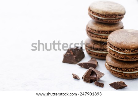 chocolate macaron with cream cheese on a white background. tinting. selective focus