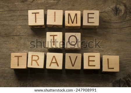 Time to Travel text on a wooden cubes