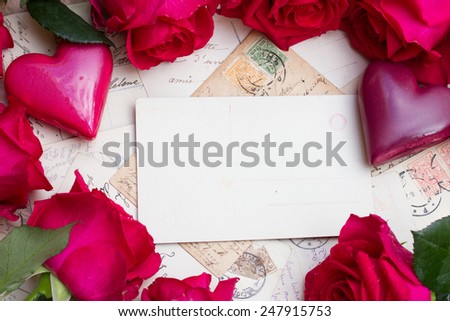 vintage background with frame of  hearts and fresh roses