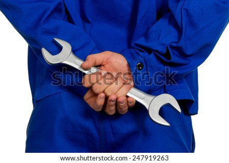 a handyman crossed fingers behind his back. lies and falsehood in the industry Royalty-Free Stock Photo #247919263