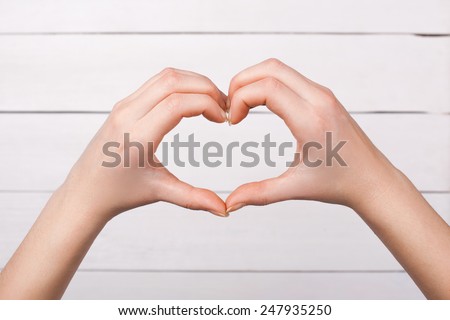 Ladies fingers show heart symbol. Love.