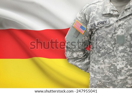 American soldier with flag on background - South Ossetia