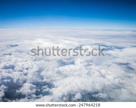 Aerial cloudscape sky in stratosphere shot from airplane window