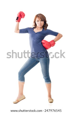 Fighting girl concept, rear view full length portrait of Asian isolated.
