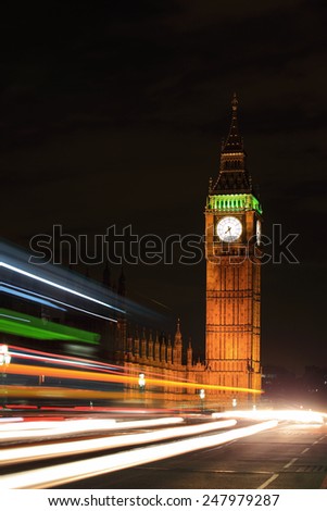 Big Ben and London at night with the lights of the cars passing by, the most prominent symbols of both London and England