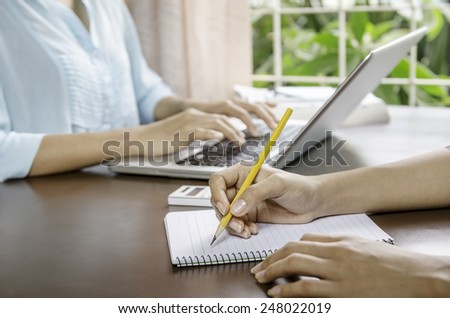 image of two women working