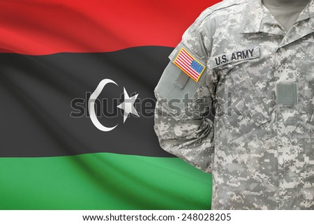 American soldier with flag on background - Libya