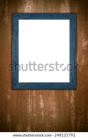 Old picture frame on vintage wood wall.