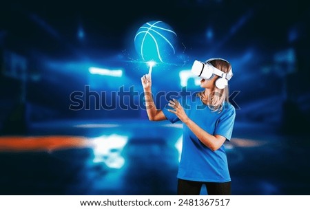 Girl pointing or spinning basketball while using VR glasses and visit sport stadium. Caucasian woman looking at ball while wearing visual reality goggles and standing at basketball arena. Contraption.