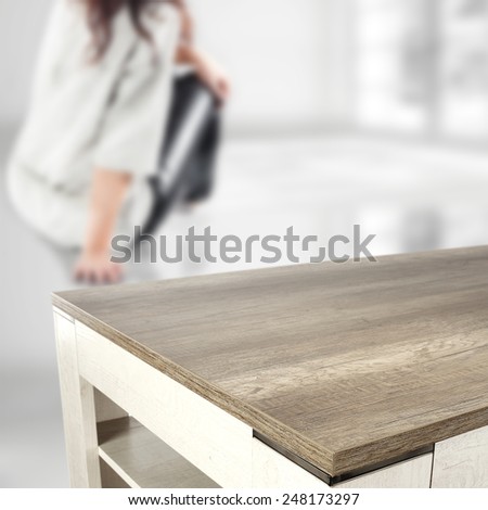 woman on floor and big coffee table 