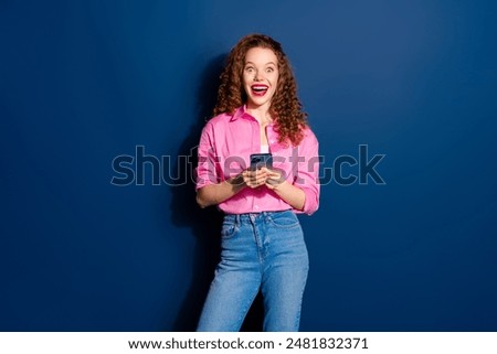 Photo of nice young woman use smart phone wear shirt isolated on dark blue color background