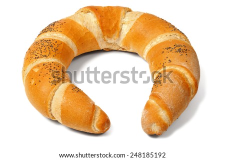 Crescent (or kifli) roll with poppy seeds  isolated on white background