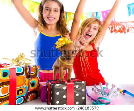 girl friends party dancing with presents and puppy chihuahua dog in birthday