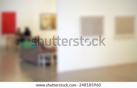 People at art gallery. Intentionally blurred post production.