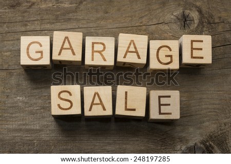 Garage Sale text on a wooden background
