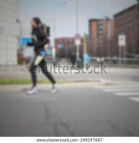 Profile of a runner, background. Intentionally blurred post production.