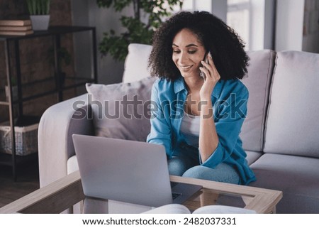 Photo of charming lovely woman wear trendy shirt work from home speak phone cozy flat room indoors