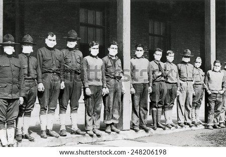 Medical men wore masks to avoid the flu at U.S. Army hospital. Nov. 19, 1918. Army Hospital No. 4. Fort Porter, N.Y. during the 1918-19 'Spanish' Influenza pandemic. Royalty-Free Stock Photo #248206198