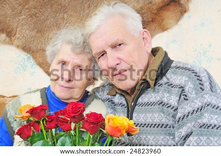 senior couple and big bouquet of roses