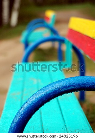 colorful benches with raindrops