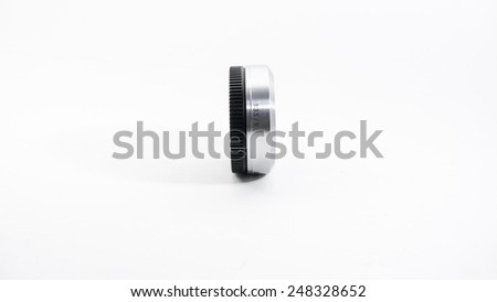 Silver metallic colour of mini compact interchangeable lens for small compact mirrorless or dslr camera gear.