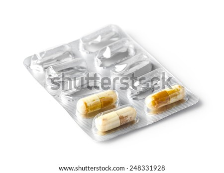 Close up expired medicine capsule isolated on white Royalty-Free Stock Photo #248331928