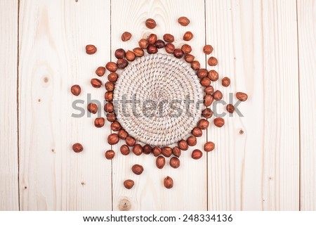 hazelnuts in diet , weight loss and healthy nutrition concept  lying   On wooden table