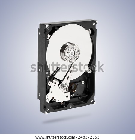 Open hard drive disk on vignette background.