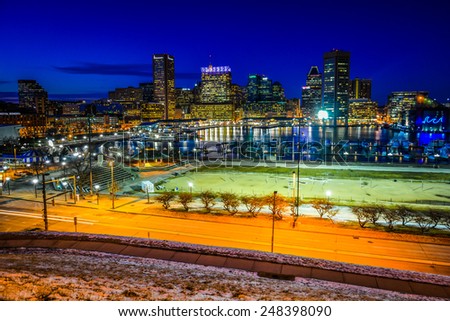View of the Baltimore skyline and Inner Harbor at night, seen from Federal Hill, Baltimore, Maryland.