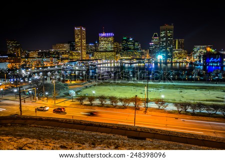 View of the Baltimore skyline and Inner Harbor at night, seen from Federal Hill, Baltimore, Maryland.