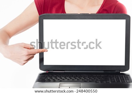 woman smile,point finger at isolated white laptop screen over white background