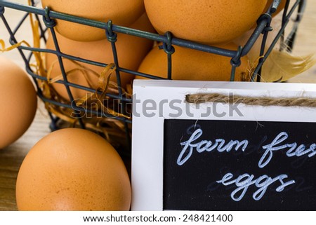 Fresh farm eggs on the wood table.