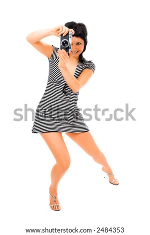 beauty girl photographer in sailor's vest with photo camera on white background