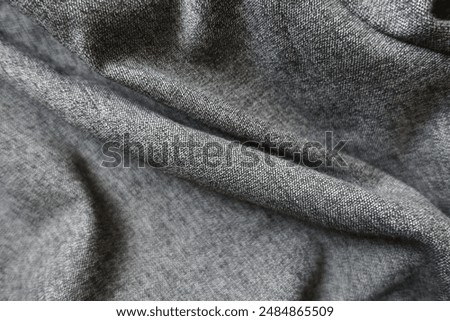 Folded heather grey viscose and polyester fabric
