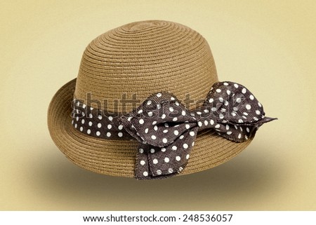 Ladies straw hat with brown ribbon on white background. picture in retro style