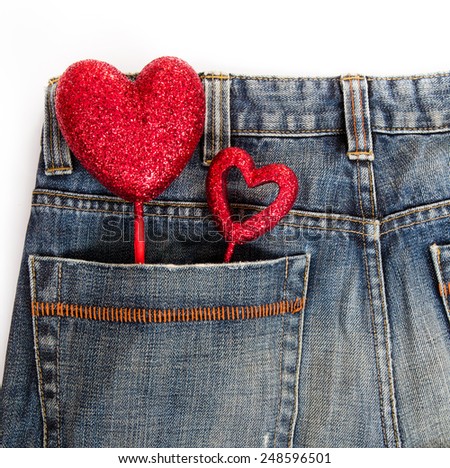 Heart in jean pocket on white isolated.