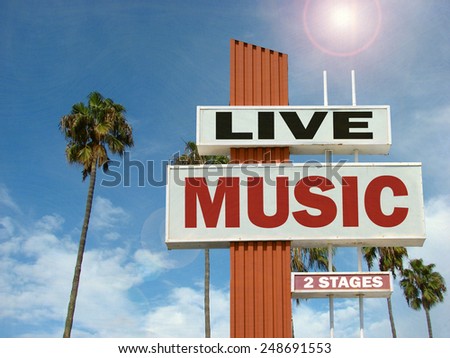  aged and worn vintage photo of live music sign with palm trees and bright sun                              