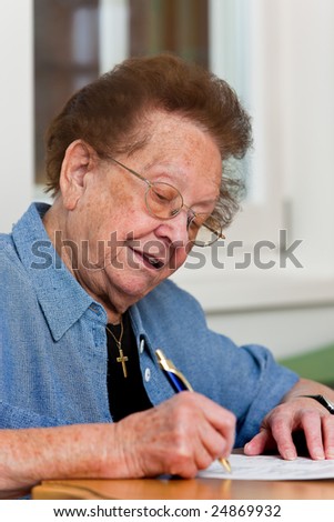 Old woman writes a letter