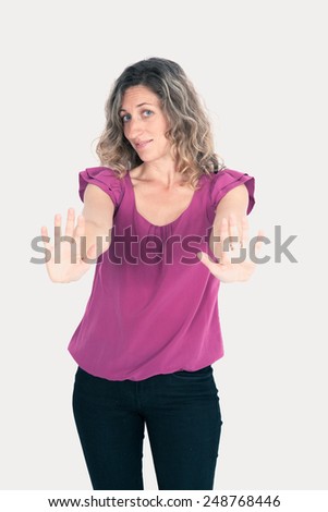 Beautiful woman doing different expressions in different sets of clothes: stop sign