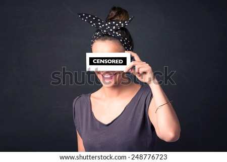 Pretty girl with censored paper sign holding in hand