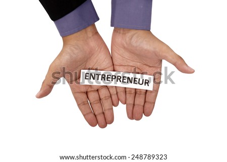 Hand holding paper with entrepreneur text isolated over white background