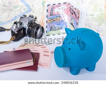 Dream destination sketch with piggy bank, passport book/  concept of savings for holiday traveling