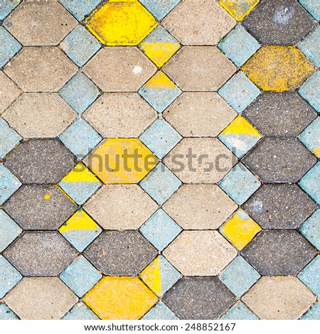 The surface of the old pavement covered with tiles texture background