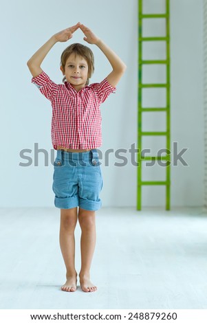 Child hands showing home