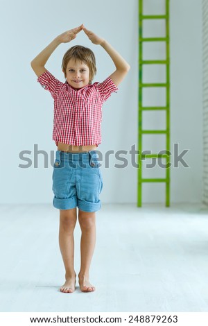 Child hands showing home