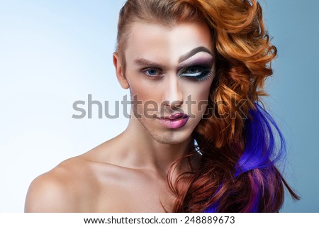 portrait of a man with a woman's make-up half-face