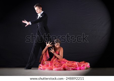The dancers in ballroom isolated on black background