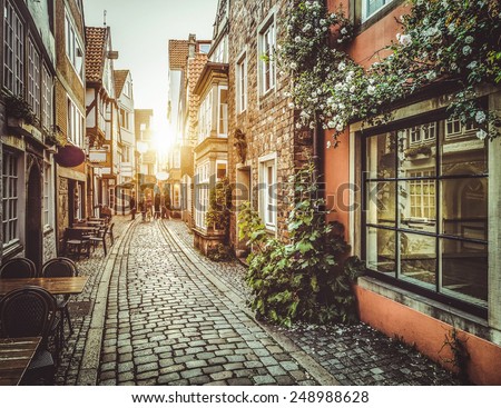 Old town in Europe at sunset with retro vintage Instagram style filter and lens flare effect Royalty-Free Stock Photo #248988628