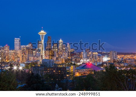 Seattle downtown skyline and Mt. Rainier at night, Washington.